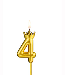 Golden number 4 birthday candle on white background
