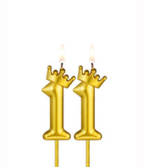 Golden candle with crown number 11 - White background