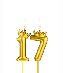 Golden candle with crown number 17 - White background