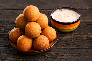 Cup of hot chocolate with Colombian buñuelos