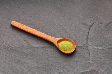 Pure dried moringa powder in a spoon - Moringa oleifera