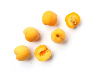 Fresh ripe apricots on a white background.
