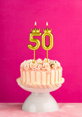 Number 50 birthday candle - Pink celebration cake with drip icing