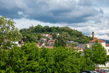 Obraz premium A cityscape with mountains of Olot, the capital city of the comarca of Garrotxa, in the Province of Girona, Catalonia, Spain