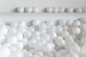 Minimalist White Plastic Balls in Play Pool or Abstract Interior
