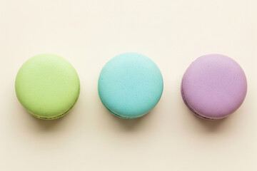 Obraz premium Colorful Pastel Macarons on Beige Background