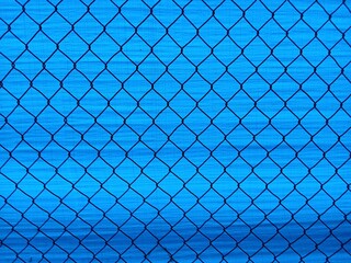 A simple, blue chain link wire fence background series. Perfect for digital designs, presentations...