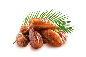 Dried date fruits with leaves isolated on white background.