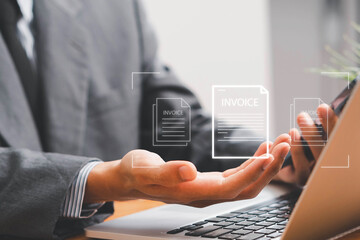 E-Invoice and Digital billing concept, Invoice, Businessman using laptop to manage electronic statements virtual screen. E-tax, Digital receipt, Online invoice processing and tax accounting solutions.