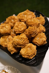 Traditional patriotic Argentinian sweet pastries. Closeup view of crispy pastelitos stuffed with quince and sweet potato jam