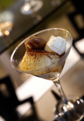 Traditional dessert in a social event. Closeup view of a delicious flan with dulce de leche and...