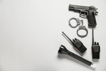 Different police equipment on white background, flat lay. Space for text