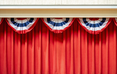 Red Curtain with Red, White, and Blue Bunting Above for a Fourth of July Celebration.