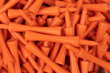 Orange Golf Tees Close-Up – 55mm Sports Equipment Background
