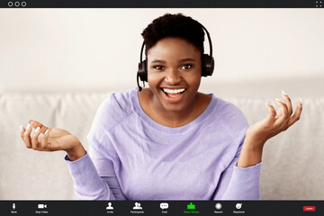 Remote Work And Technology. Black Woman Wearing Headset Having Video Conference, Talking To Camera...