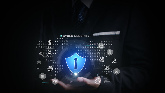 Businessman presenting glowing cybersecurity shield surrounded by digital icons, representing secure network, data protection, and digital privacy in a virtual business environment. 3d Rendering