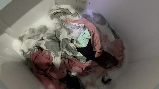 Washing clothes process inside top load washing machine
