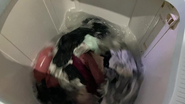 Washing clothes process inside top load washing machine