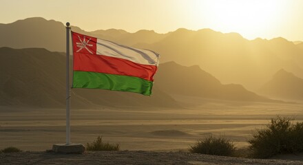 Omani Flag Waving in Golden Sunset Light Over Desert Mountains