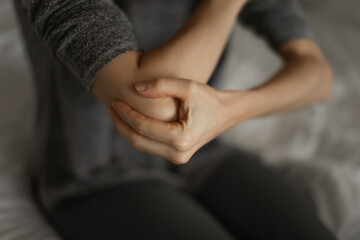 Woman with elbow injury, pain relief concept concept, muscle pain due to lateral epicondylitis or tennis elbow injury, Health care concept