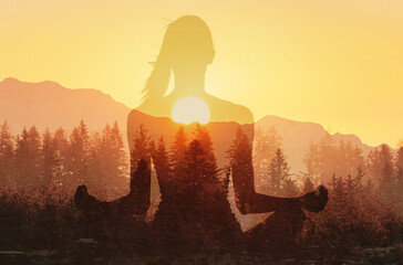Young woman practicing meditation facing mountain sunset. Harmony, meditation, healthy mind, relaxation, yoga, self care, mindfulness concept