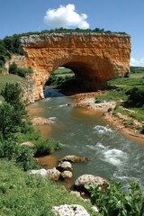 Natural Bridge over River in Rural Setting