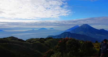 beautiful view of mountain peaks, with white clouds