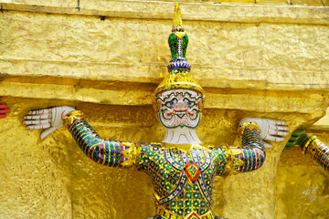 Detailed Golden Sculpture of Traditional Figure in Thai Temple Art