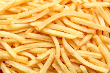 Tasty french fries as background