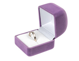 A simple, silver band rests inside a purple velvet ring box, subtly hinting at a proposal or special occasion