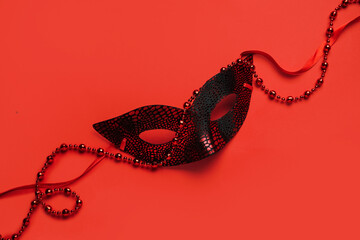 Carnival mask on red background