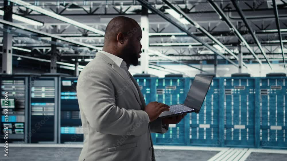 Poster server room infrastructure engineer scripting automated workflows using software on laptop. data cen