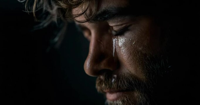 Bearded Man Weeps in Shadows
