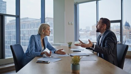 Two nervous startupers arguing at panoramic cabinet. Man shouting businesswoman - Powered by Adobe