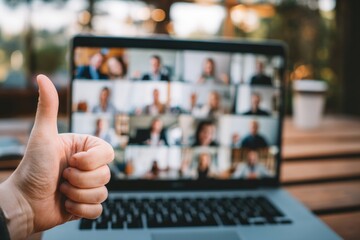 Businessman showing thumbs up gesture during video conference with colleagues, expressing approval and satisfaction with successful teamwork