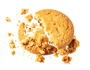 A golden-brown biscuit, broken in half, with crumbs scattered around it, shot against a black background