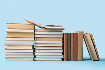 Stacks of books on blue background