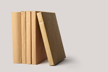 Row of books on grey background