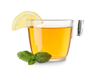 Glass cup of hot mint tea with slice of lemon on white background
