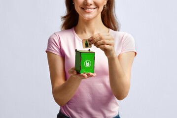 Conceptual Image For Waste Sorting. Woman Putting Card With Drinking Glass Icon Into Small Wooden...