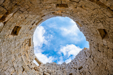 Drakano tower looking up inside military watchtower archeological site wall on Ikarian Sea, Greek Aegean islands region of Ikaria island, Greece