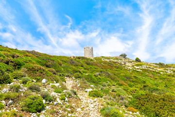 Drakano tower hiking trail path fence view of landscape on Ikarian Sea at Greek Aegean islands...