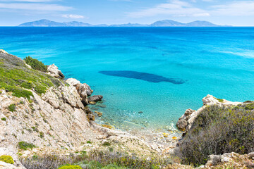 Saint George beach turquoise water from Drakano tower on Ikarian Sea, Greek Aegean islands of Ikaria island, Greece by Samos Fournoi islands