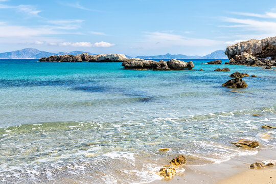 Saint George beach clear azure water on Ikarian Sea, Greek Aegean Ikaria island, Greece by Samos Fournoi islands