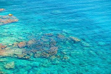 Obraz na płótnie Canvas Therma, Ikaria island water aerial view in Greece longevity blue zone by thermal hot springs at Prioni beach at Greek Icarian sea