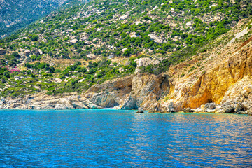 Famous Seychelles beach people swimming on Ikaria island, Greece longevity blue zone by Icarian sea ocean water