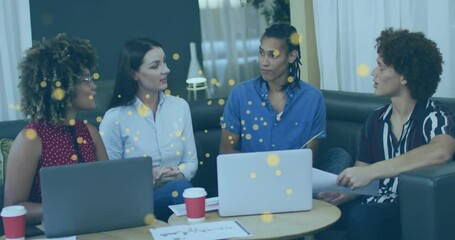 Team of four discussing crypto in lounge while golden particles drifting into Bitcoin network - Powered by Adobe