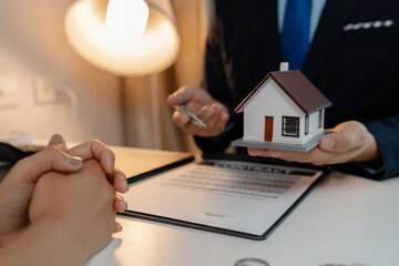 staff is explaining the information about the house lease contract documents to the buyer, the...