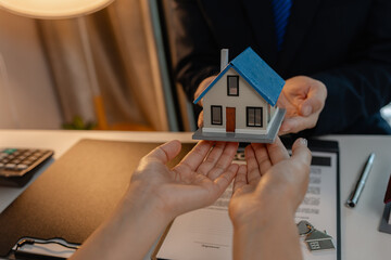staff is explaining the information about the house lease contract documents to the buyer, the...