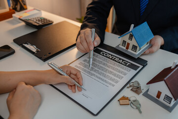 staff is explaining the information about the house lease contract documents to the buyer, the...